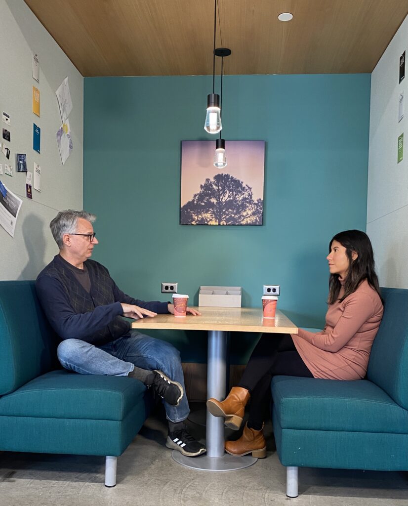 Executive leadership coach meeting one-on-one with a client during a coaching session.
